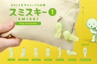 SMISKI strap accessories with a hand holding one, on a yellow background at keapop.